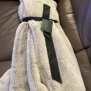 Gray brand new throw by Magaschoni